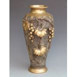 Japanese bronze/ brass vase with grape and vine decoration in relief and mark to base, 38cm tall