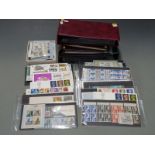 A good range of GB QEII stamps including high value definitive sets in presentation packs, first day