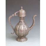 Persian/ Indian pedestal coffee pot with deep relief decoration of flowers, elephant trunk spout,
