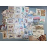 A small collection of postcards including WWI silks and embroidered Spanish girls wearing