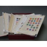 A box file of USA, South America, Asia and other stamps on loose album pages