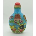 Chinese glass perfume bottle decorated in overlaid design of underwater creatures on blue ground,