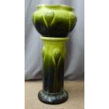 An earthenware jardiniere on stand, H82cm