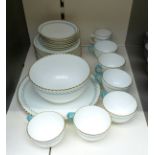 A collection of blue, cream and gilt teaware, probably Minton