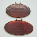 Two carnelian agate pendants with engraved script