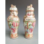 A pair of 19thC Chinese Canton famille rose covered vases of baluster form with figural court