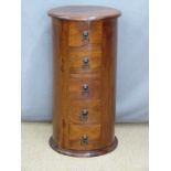 An Eastern hardwood circular chest of five drawers, diameter 35cm, H76cm