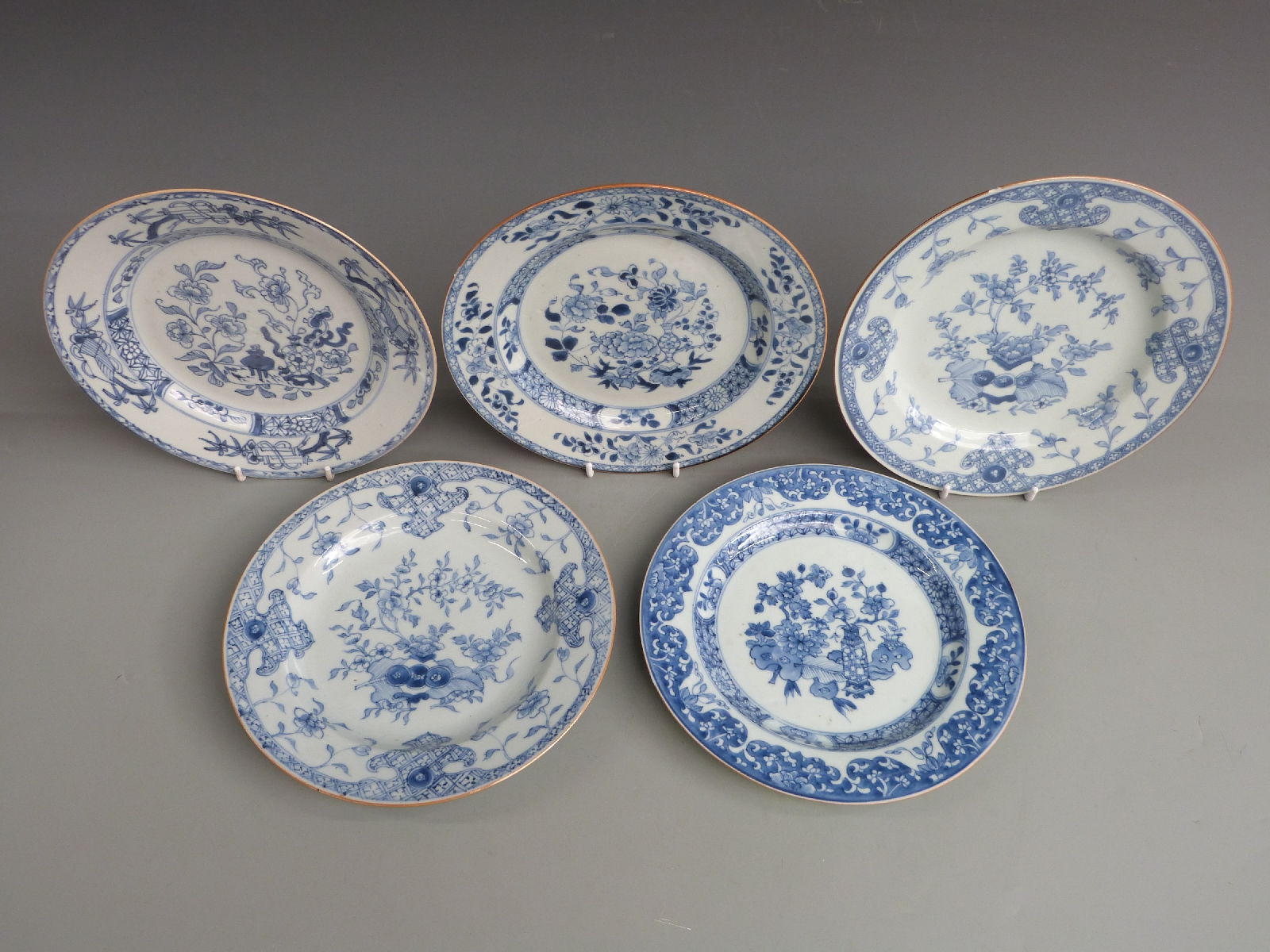 Five 19thC Chinese export plates decorated with vases of peonies, chrysanthemums, fruit and - Image 2 of 3