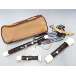 Aulos composite bodied bass recorder, in soft carry case with shoulder strap no. 533-EB
