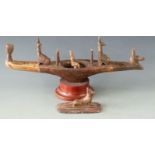 Carved soapstone model of an Egyptian Nile barge or barque with god figures, raised on a circular