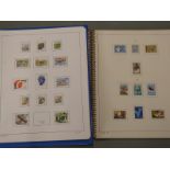 An extensive collection of Finland stamps in five stockbooks and albums