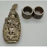 Chinese white metal snuff bottle on chain with four character mark to base and clip with fish and