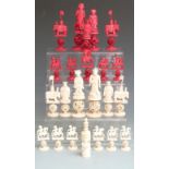 Chinese carved bone puzzleball part chess set, approximately 24 pieces (two with no puzzleballs),