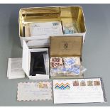 A tin of stamps including stockcards, covers, Coronation omnibus stamps and a Marley Bright