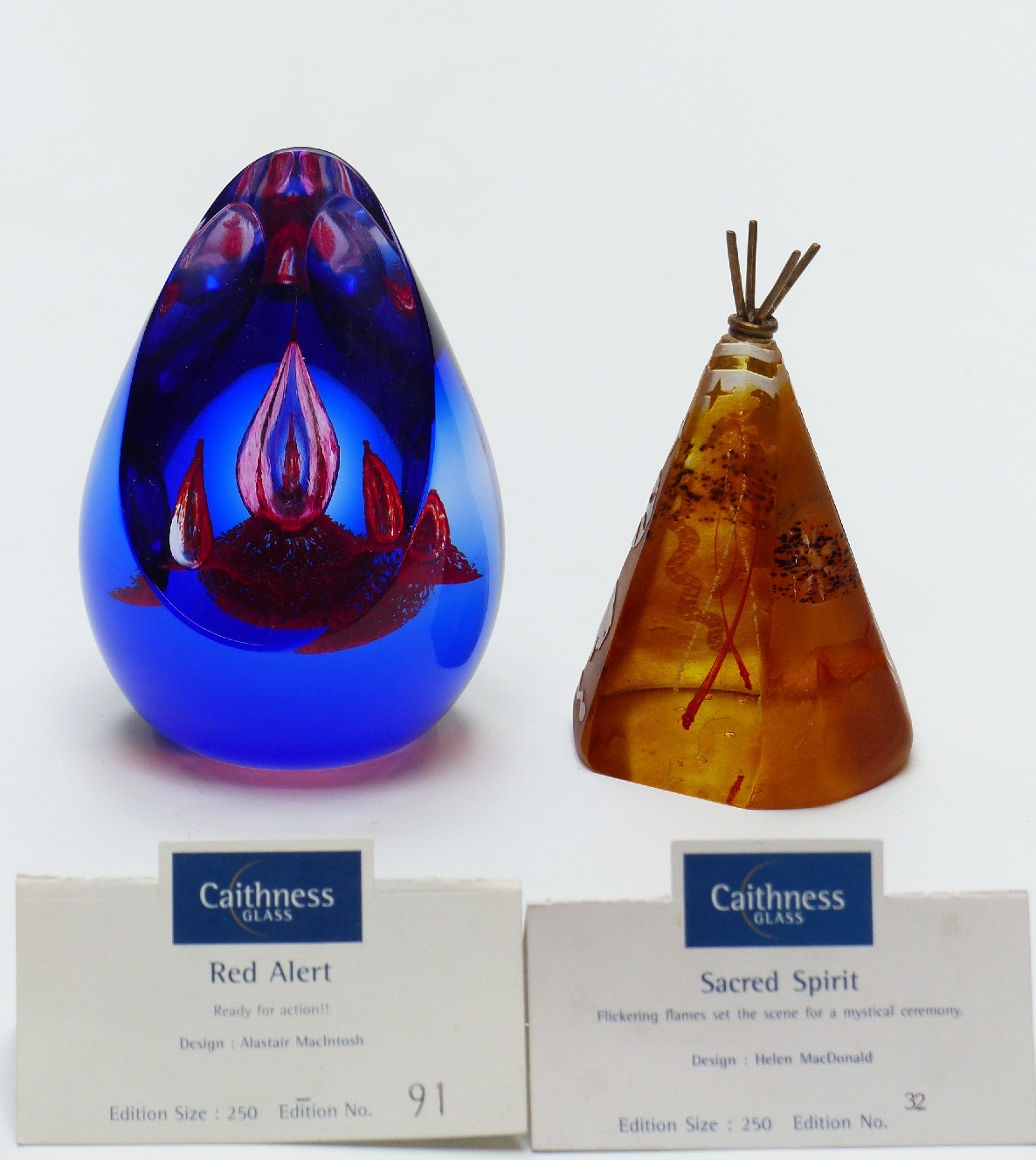 Two Caithness limited edition glass paperweights, Sacred Spirit and Red Alert, tallest 10cm