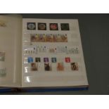 An album of GB QEII mint stamps, presentation packs etc