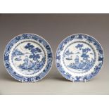 Near pair of 19thC Chinese export plates decorated with a figure on the shore with fishing boats,