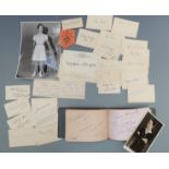 Collection of autographs on calling cards and in an autograph book to include 1930's tennis stars