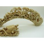 19thC Chinese ivory tusk finely carved with village scenes including buffalo, man on horseback etc