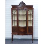 Late 19th or early 20thC bow fronted glazed display cabinet with inlaid decoration W110 x D42 x