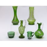 Six pieces of Mary Gregory green glassware all with white enamel decoration, largest 26cm tall
