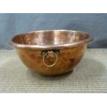 A 19thC copper mixing bowl with brass suspension loop, diameter 28.5cm