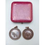 Two Royal Life Saving Society bronze medals awarded to P B Dawson May 1933 and A Flatow June 1929,