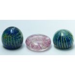 Two Mdina paperweights and a Guernsey glass paperweight, largest 10.2cm in diameter