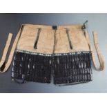Japanese Edo period haidate yoroi (thigh armour) of lacquered leather construction with silk lining,