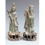 A pair of Chinese carved hardstone figures on pierced bases, H20cm