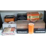 Large quantity of Guinness branded items including 24 glasses, miniature bottles, tea towels,