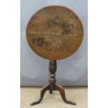 19thC circular tilt top table raised on a turned column and tripod base, diameter 53 x H68cm