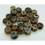 Twenty five Tibetan hardstone beads