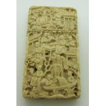 19thC Chinese carved ivory card case with decoration of village scenes, H8.5 x W4.5cm