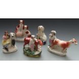 Five Staffordshire figures including a cow creamer, girl with dog etc, tallest 21cm