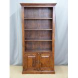A hardwood bookcase with cupboard under, W90 x D40 x  H180cm
