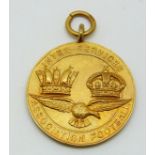 A 9ct gold Inter-service Association Football medal with eagle below two crowns, engraved verso