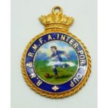 A 9ct gold and enamel RN & RMFA Inter-port Cup football medal, 9.7g