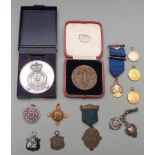 A small collection of commemorative medals / medallions including Army Athletic Association, Royal