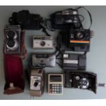 Cameras to include Photoina Reflex TLR, Polaroid, Kodak disc camera, Colorshot Specto 88 cine