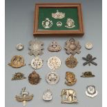 A small collection of cap badges including Rifles, Light Infantry, Machine Gun Corps. etc