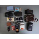 Vintage cameras and accessories to include Olympus Trip 35, Ilford Advocate, Kodak folding camera