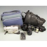 Pentax P30 SLR camera with 1:3.5-4.5 35-70mm lens together with a Panasonic NV-DS150B digital