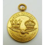 A 9ct gold Inter-service Association Football medal with eagle below two crowns, engraved Winners