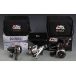 Abu Garcia closed face and fixed spool fishing reels in boxes, the closed face reels with soft cases