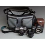 Canon EOS 600 SLR camera body and a Minolta XD5 with two Minolta 50mm 1:2 lenses and a winder unit