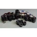 Four SLR cameras comprising Ricoh KR-10, Pentax Program A, Praktica MTL5B and Yashica FX-2 and
