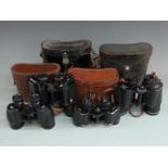 Four pairs of binoculars comprising Ross 9x35, Wray of London 8x40, Pentax Ashanti 10x50 and