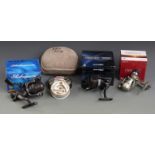 Three fixed spool fishing reels in boxes and a quantity of line, includes Sigma 30FS and Matrix