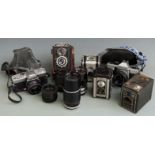 Quantity of cameras to include Minolta srT100x SLR with Rokkor 45mm 1:2 lens, Praktica MTL5B with